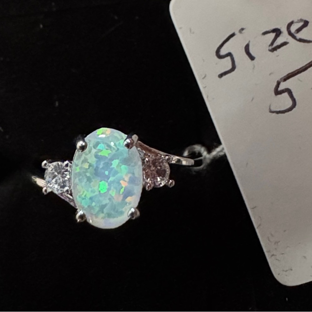 New…Faux opal in a silver band size 5